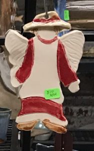 red and white clay angel with green price tag
